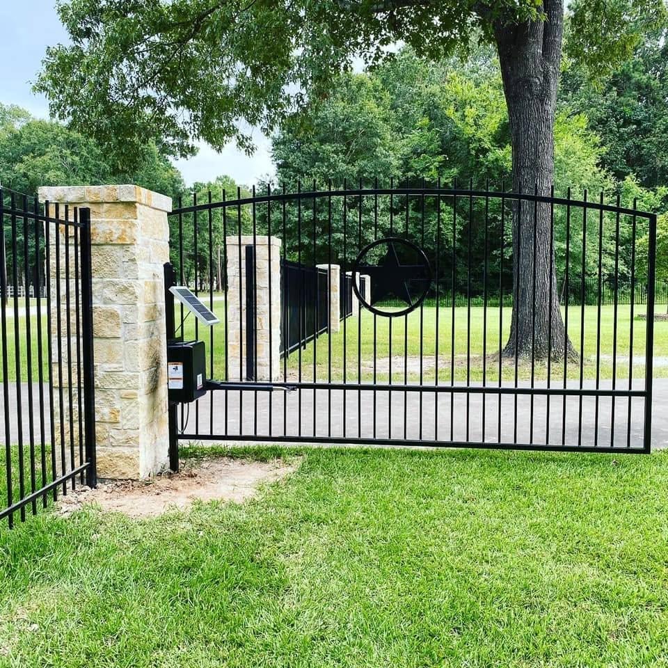 Custom iron gate with Texas star and operator — Access Pro Gate Company