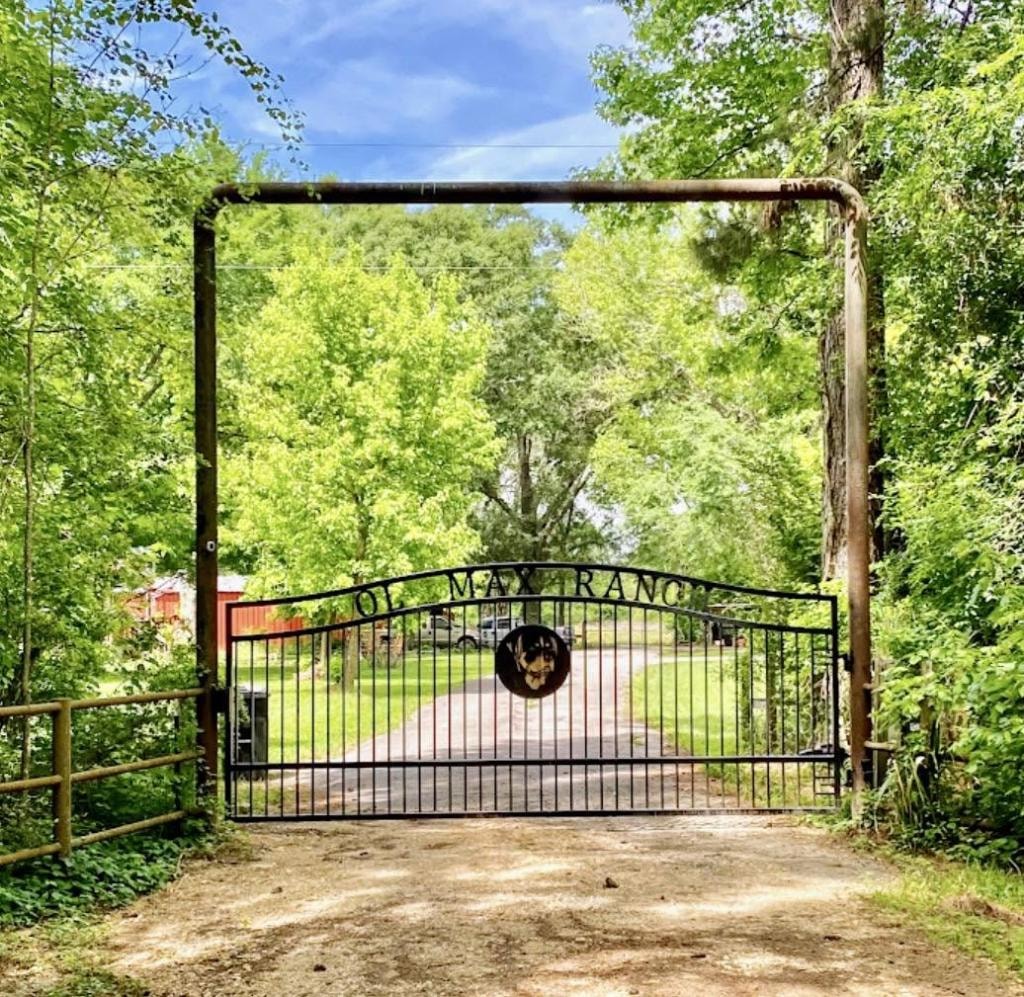 Custom ranch gate with Ol Max Ranch lettering and deer medallion — Access Pro Gate Company