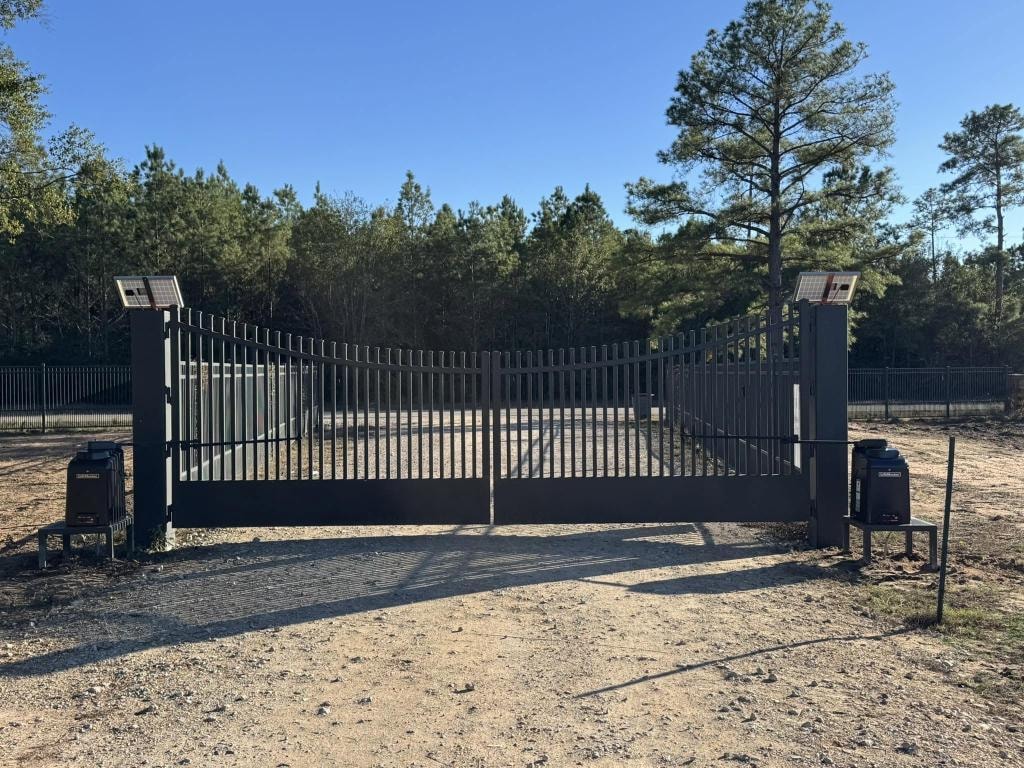 Dual swing gate with solar panels installed by Access Pro Gate Company in Montgomery County TX