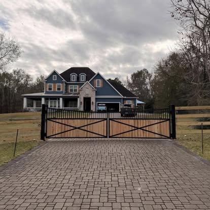 Custom wood and iron driveway gate installed in Montgomery County TX
