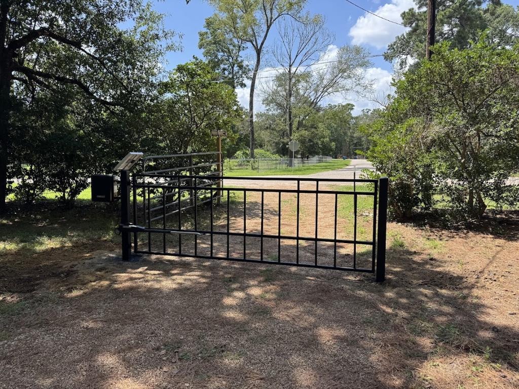 Swing gate operator installed on residential driveway gate — Access Pro Gate Company