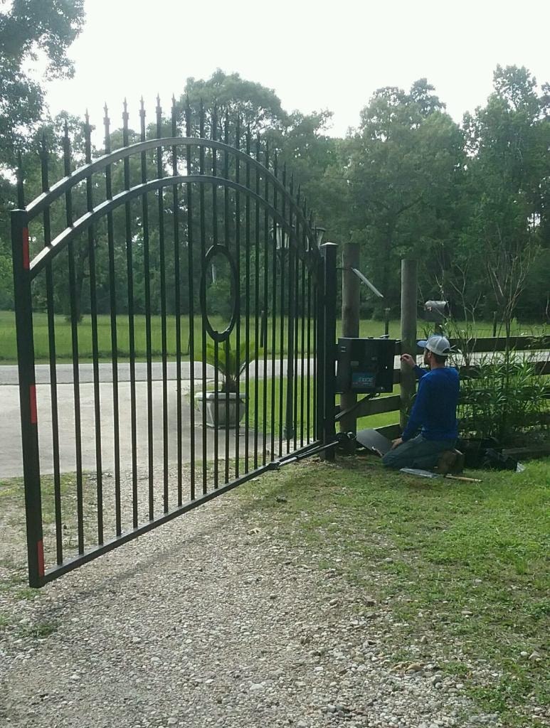 Access Pro Gate Company crew working on ornamental iron gate